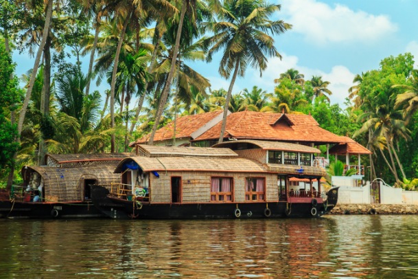 Houseboat parked in front of kerala house